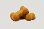 Bone-shaped pet treats on display in warm golden-brown color.