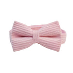 Pink corduroy bowtie accessory with adjustable band and bow knot