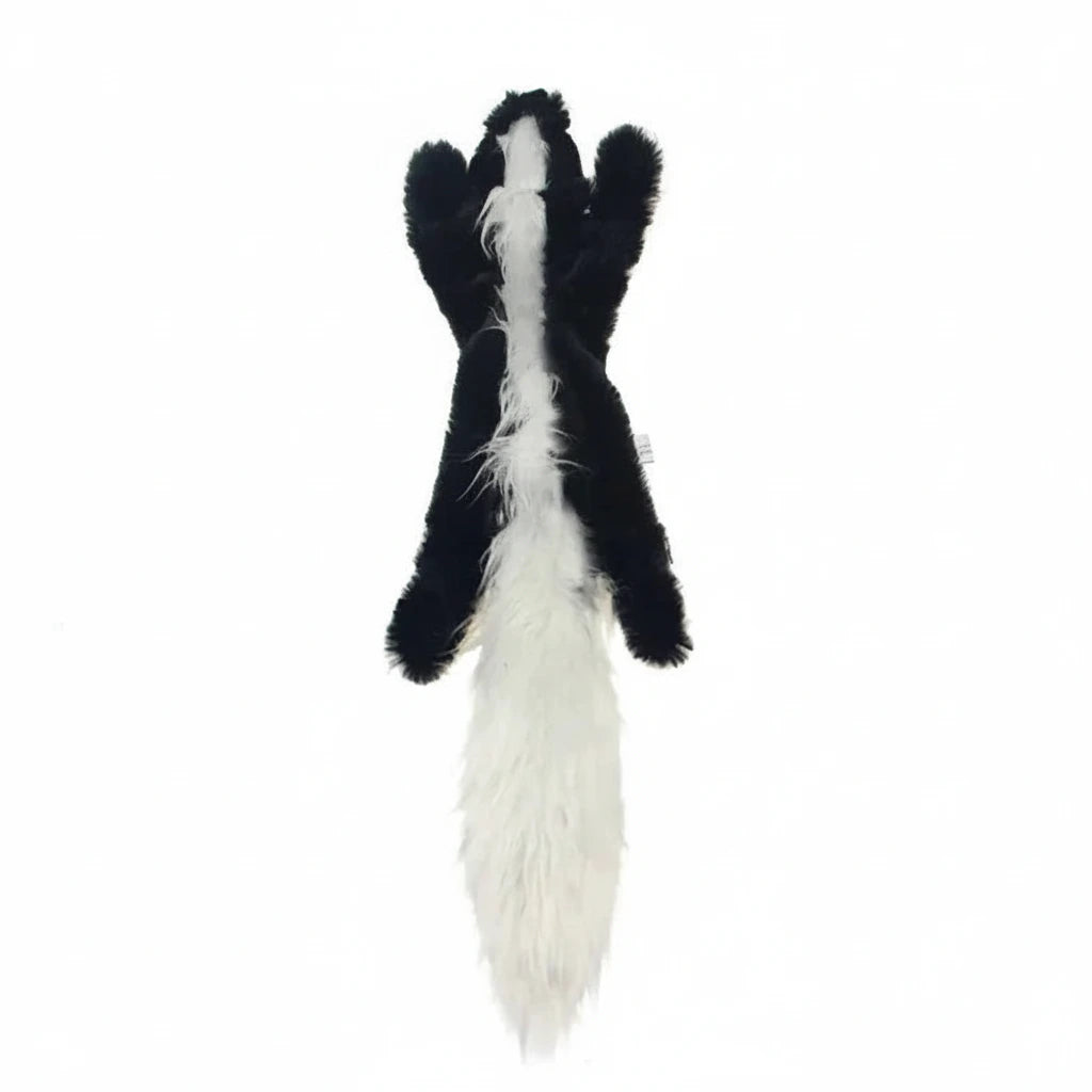 Black and white skunk-shaped plush chew toy with a long tail.