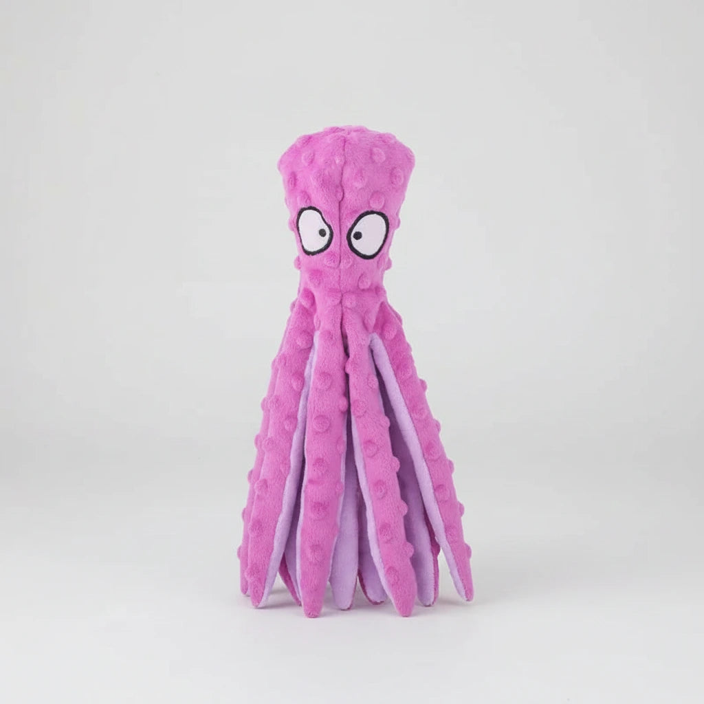 Pink octopus-shaped plush chew toy with large eyes.