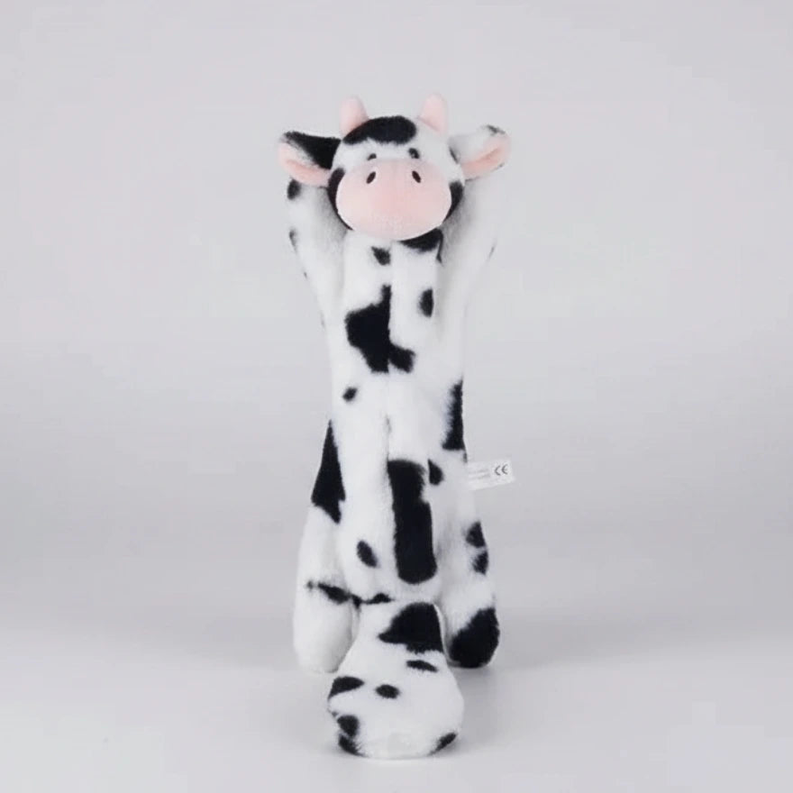 Cow-shaped chew toy, white with black spots and a small pink nose