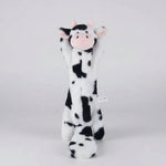 Cow-shaped chew toy, white with black spots and a small pink nose