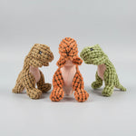 Animal-shaped rubber molar chew toy set: orange, tan, and green figures