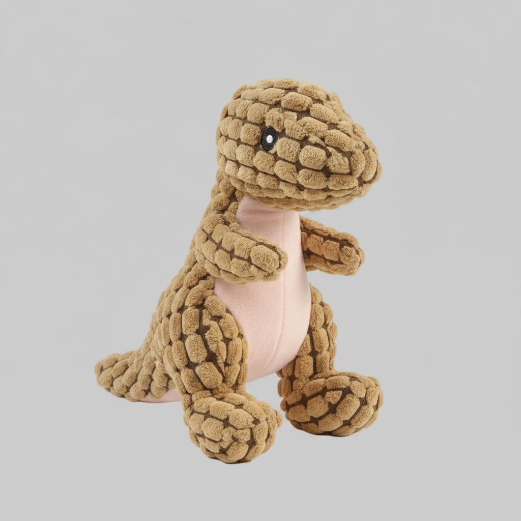 Tan animal-shaped rubber molar chew toy with textured body and black button eyes