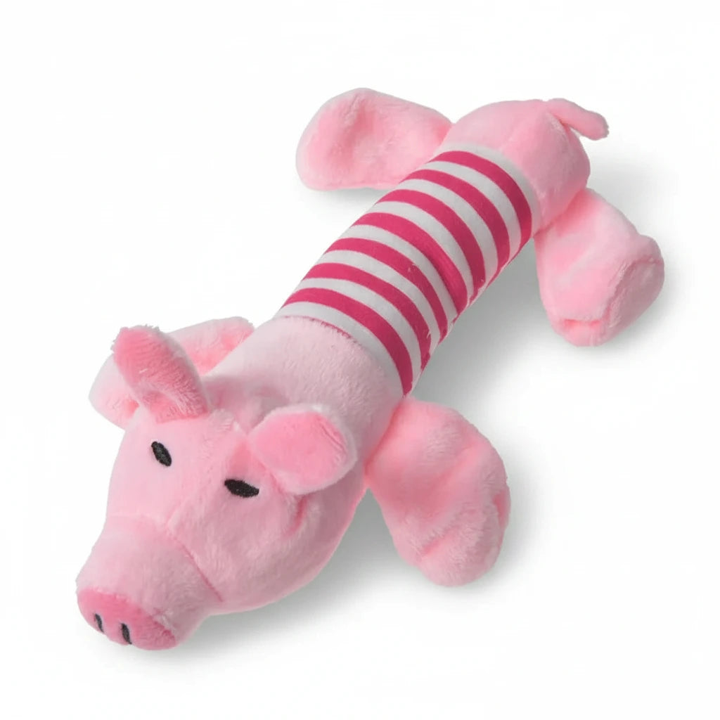 Pink pig-shaped chew toy with red-and-pink striped body.