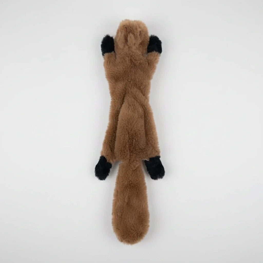Animal-shaped chew toy, tan with black paw accents and long body