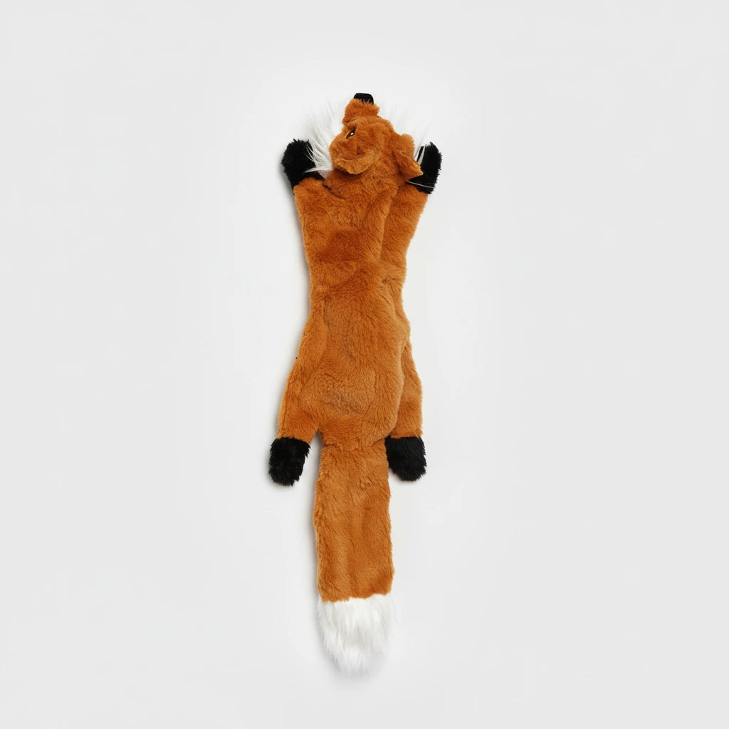 Animal-shaped chew toy, orange with black paws and small white tail tip