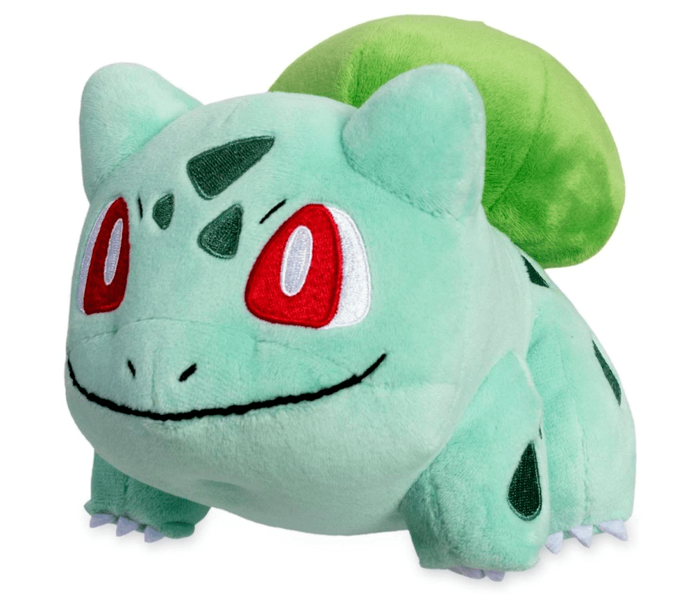 Stuffed plush dog toy, green round lizard-like plush with large red nose spots and cartoon eyes