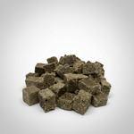 Pile of freeze-dried blackworm cube pellets in dark green-gray