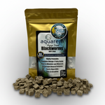 Freeze-dried blackworms pouch with visible cube pellets and a pile of cubes