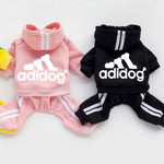 Pink and black pet four-leg hoodies with hooded neck, adidog logo, and striped legs.