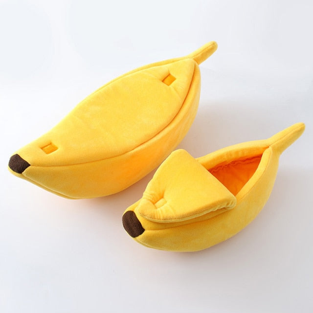 Yellow banana-shaped pet bed with plush interior lining and rounded opening