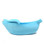 Light blue banana-shaped pet bed with plush bolster cushions and stitched opening