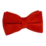 Red velvet dog bowtie with centered knot, plush deep red fabric