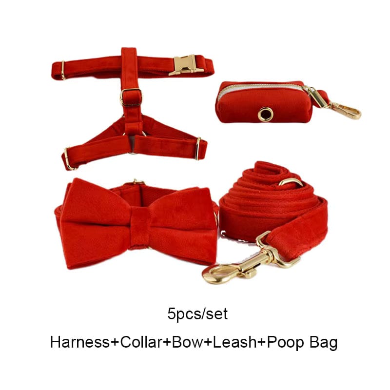 Red velvet dog harness and collar set with bowtie, leash, and poop bag pouch