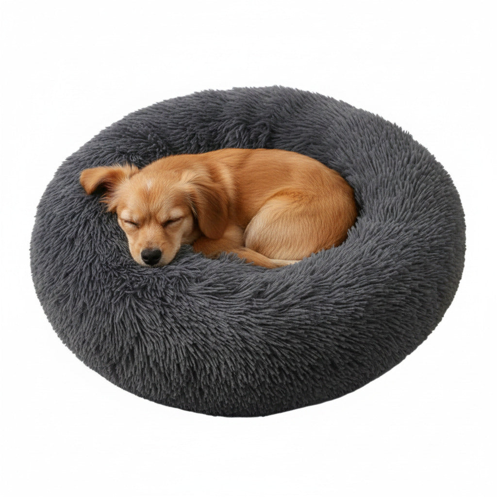 Plush donut pet bed in dark charcoal, with small dog curled inside