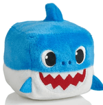Blue plush shark-shaped dog squeaky toy with white belly and red zigzag mouth