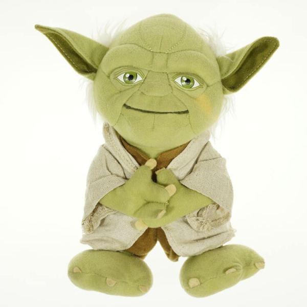 Yoda plush dog toy with light green face, beige robe, and spread hands