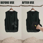 Black grooming mitt with yellow tab, used to remove pet hair from a dark vest