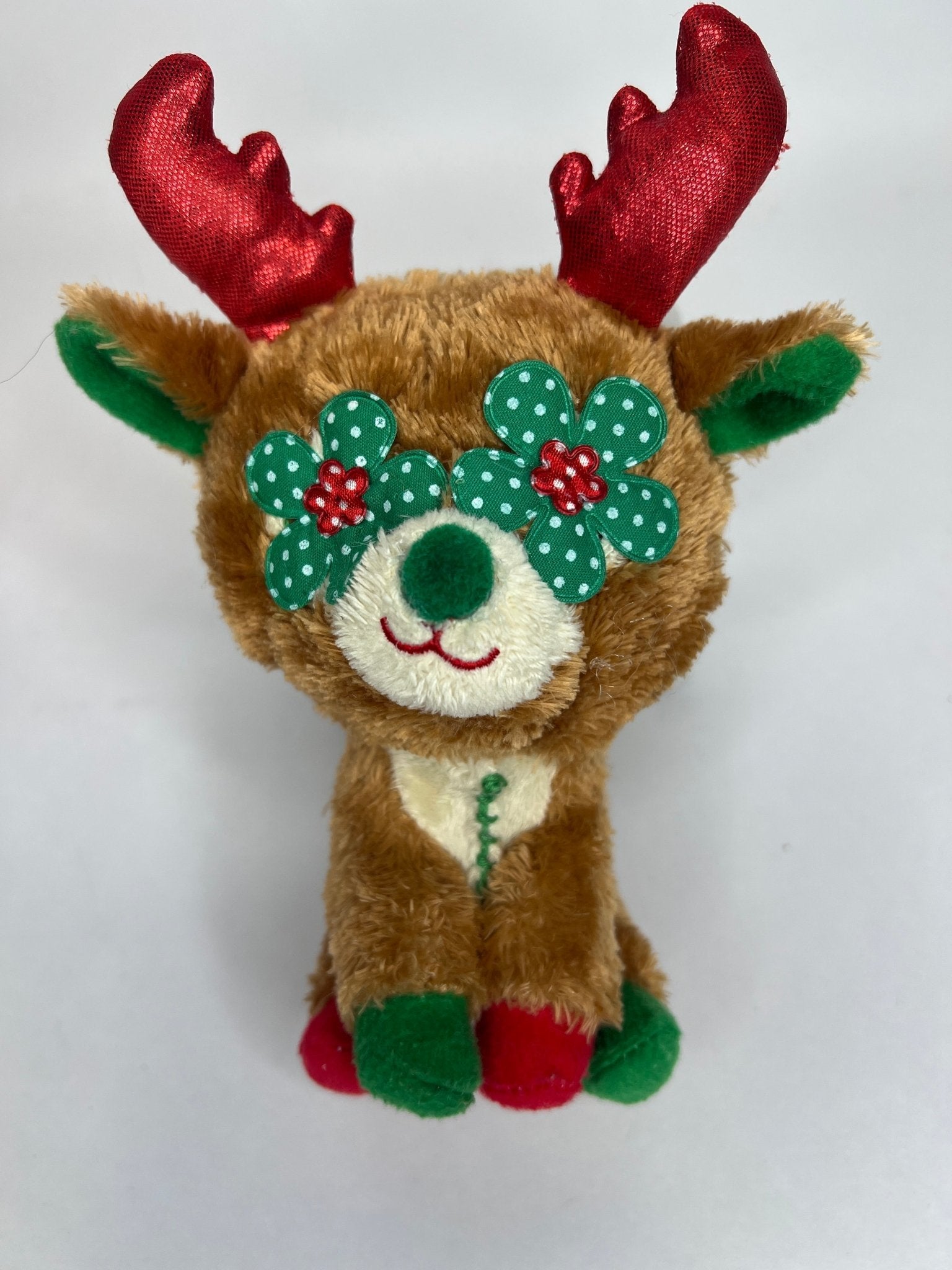 Holiday squeaky plush reindeer toy with glitter antlers and teal floral accents
