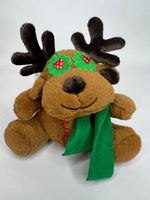 Brown reindeer plush with green scarf and festive holiday patches, soft stuffed toy