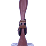 Brown fetlock boots with buckle straps, front view