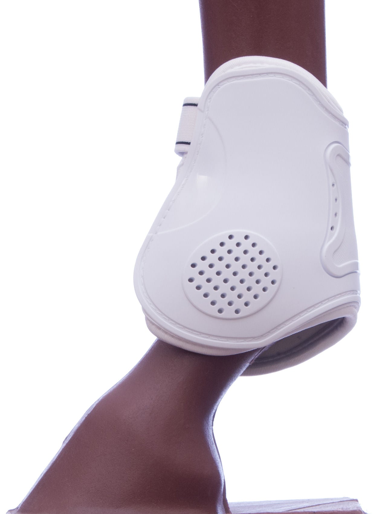 White fetlock boot front with perforated circular panel