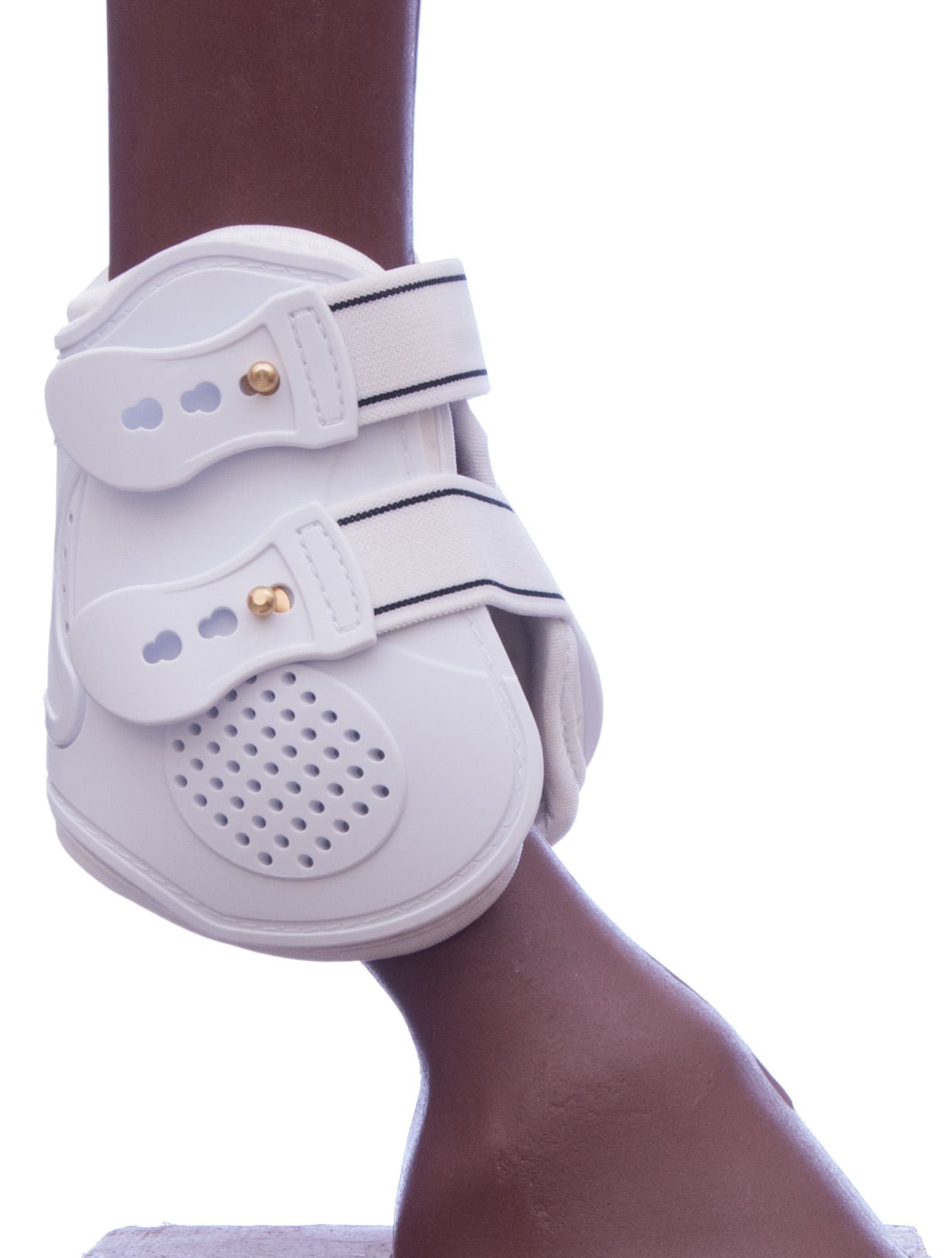 White fetlock boot side with perforated toe pad and metal studs