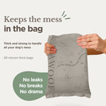 Thick compostable dog waste bag pouch held in hands, light gray-beige