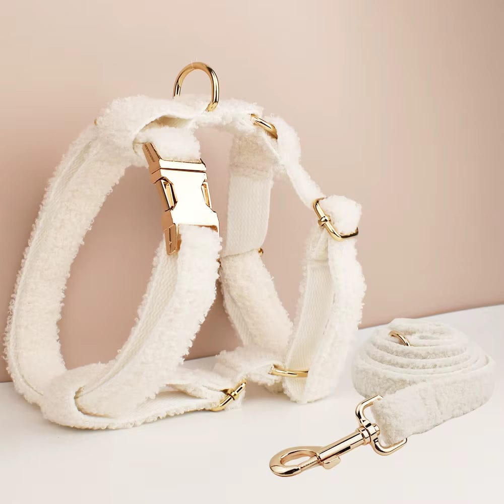 Off-white teddy knit pet harness with gold-tone clips and matching leash