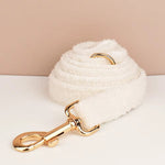 Off-white teddy knit pet leash with gold-tone clasp and curved handle ring