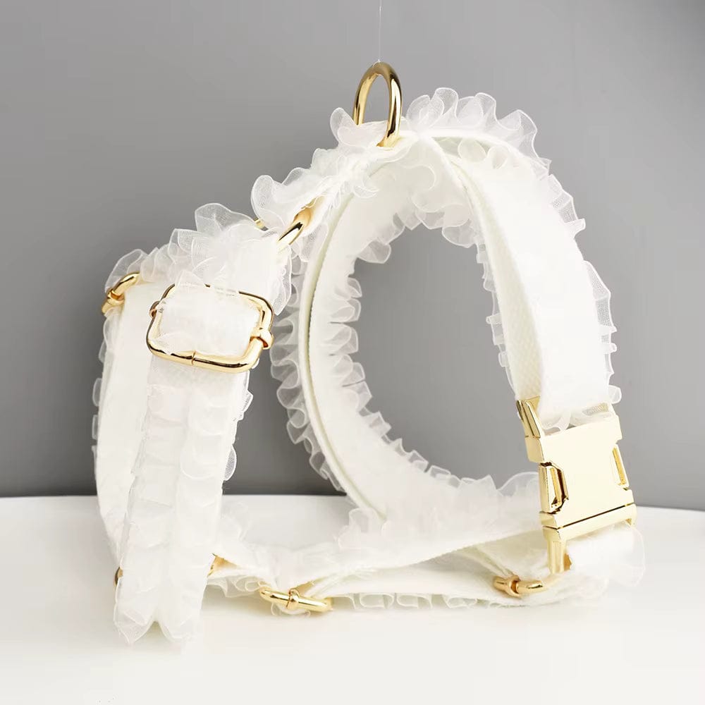 White lace dog harness with ruffled straps and gold buckles
