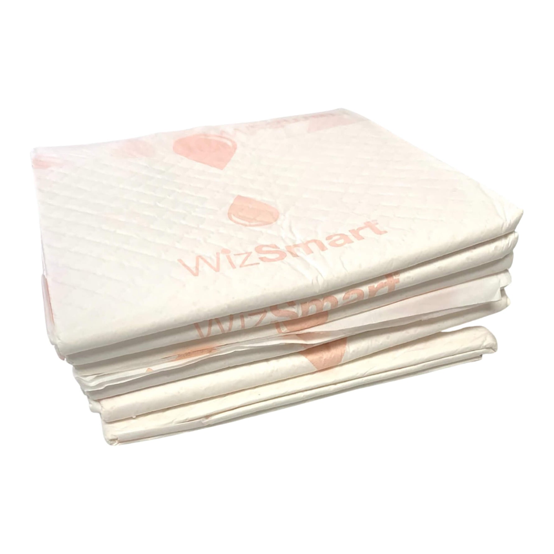 Stack of off-white dog training pads with small pink heart patterns on top layer