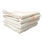 Stack of white WizSmart heavyweight dog training pads with light print details.