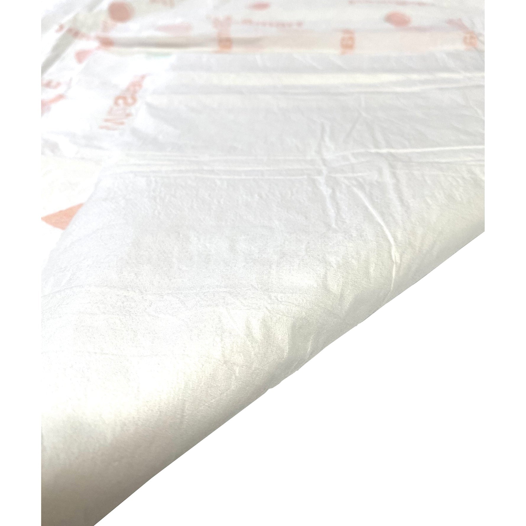 WizSmart heavyweight dog training pad, white absorbent surface in close-up.